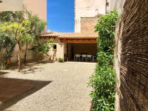 an outside view of a house with a patio at ALMAHOME in El Arenal