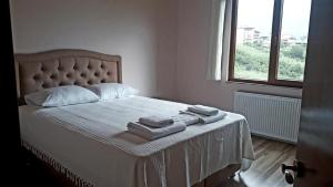 Ένα ή περισσότερα κρεβάτια σε δωμάτιο στο Erdem Apart Otel
