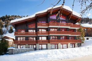 a large building with snow in front of it at VVF Résidence Plagne 1800 Paradiski in Plagne 1800