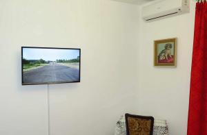 a flat screen tv hanging on a wall at Villa Nada in Zadar