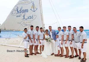 a bride and groom and their wedding party on a sailboat at Fairways and Bluewater Boracay in Boracay
