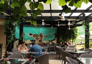 a restaurant with people sitting at tables at Fairways and Bluewater Boracay in Boracay