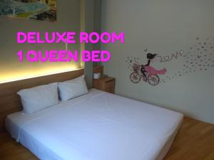 Postel nebo postele na pokoji v ubytování Lavana Hotel Batu Caves