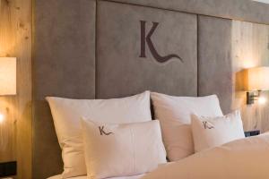 Ένα ή περισσότερα κρεβάτια σε δωμάτιο στο Hotel Karlwirt