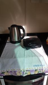 ボンビーニャスにあるNovo Lar 1 Bombinhas (Eliseos)のお茶ポット +9枚の写真