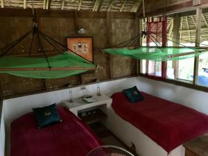 Una cama o camas en una habitación de Sang Tong Huts