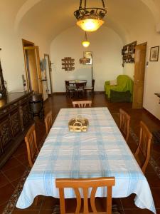 a dining room with a table and chairs at La Casa Del Nonno Raffaele- Country house in Ravello