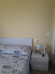 Postel nebo postele na pokoji v ubytování AL FARO