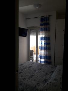 Postel nebo postele na pokoji v ubytování AL FARO