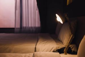 Letto o letti in una camera di Clay Hotel Udonthani