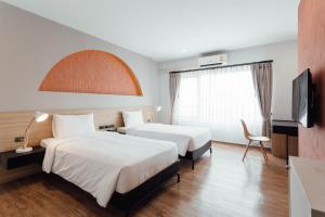 Letto o letti in una camera di Clay Hotel Udonthani