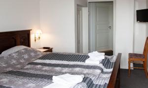Vuode tai vuoteita majoituspaikassa Ballum Slusekro