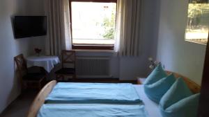 Postel nebo postele na pokoji v ubytování Lamplhof B&B