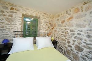 Postel nebo postele na pokoji v ubytování Villa Kamena