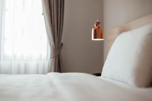 Letto o letti in una camera di Clay Hotel Udonthani