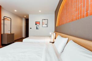 Letto o letti in una camera di Clay Hotel Udonthani