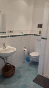 a bathroom with a sink and a toilet at Bella Villa in Traben-Trarbach +21 photos