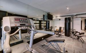 a room with a gym with a treadmill at Svelte Hotel and Personal Suites in New Delhi