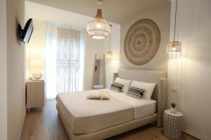 A bed or beds in a room at Amor di Casa