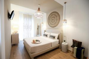 A bed or beds in a room at Amor di Casa