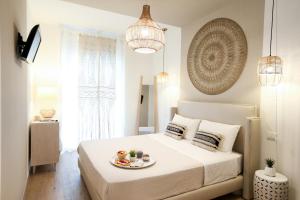 A bed or beds in a room at Amor di Casa