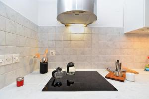 a kitchen with a sink and a counter top at House Silvo 1953 in Vodnjan +36 photos