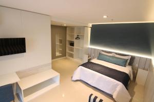 Postel nebo postele na pokoji v ubytování Hotel Bossa Nova Cabo Frio