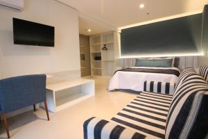 Postel nebo postele na pokoji v ubytování Hotel Bossa Nova Cabo Frio
