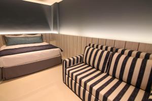 Postel nebo postele na pokoji v ubytování Hotel Bossa Nova Cabo Frio