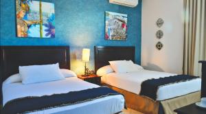 Katil atau katil-katil dalam bilik di Hotel Presidente Las Tablas