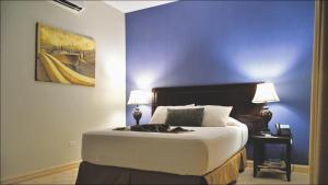 Katil atau katil-katil dalam bilik di Hotel Presidente Las Tablas