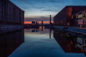 a body of water next to some buildings and a building at Titanic Hotel Liverpool in Liverpool