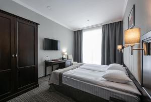 Ліжко або ліжка в номері Optima Collection Park Hotel Ivano-Frankivsk