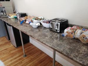 a kitchen counter with a tray of food on it at Hotel Quartier des Spectacles in Montreal