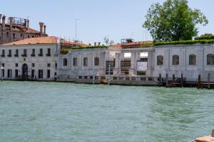 a group of buildings on the water next to a building at Ca' Coriandolo in Venice