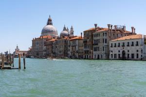 a view of a river with buildings and buildings at Ca' Coriandolo in Venice