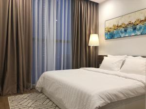 a bedroom with a white bed and a large window at Luxury Condotel 2BR Vinhomes Skylake Keangnam - Netflix free in Hanoi +34 photos