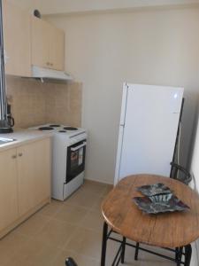 A kitchen or kitchenette at Milka's old Corfu town apartment