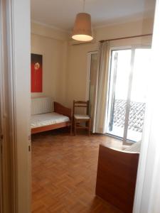 A bed or beds in a room at Milka's old Corfu town apartment
