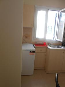 A kitchen or kitchenette at Milka's old Corfu town apartment