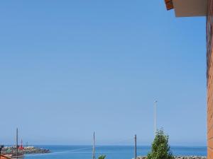 a view of the ocean from a building at Little Rose guest house in Fiumicino