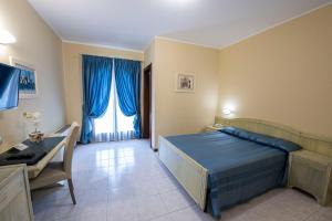 Postel nebo postele na pokoji v ubytování Hotel Cristoforo Colombo + 37 fotografií
