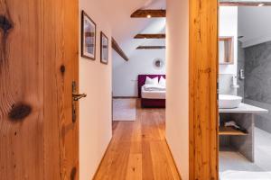Postel nebo postele na pokoji v ubytování Appartementhaus Plainstöckl Hotel Gasthof Maria Plain