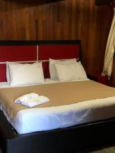 מיטה או מיטות בחדר ב-Cabañas La Finca