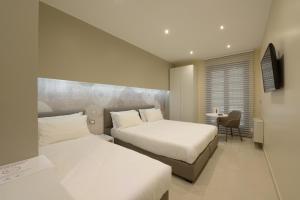 Voodi või voodid majutusasutuse Imperiali Hotel toas