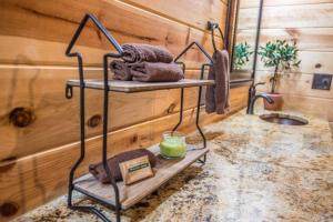 a bathroom with a shelf with towels and a sink at Indian Springs Lodge-Game Room, Video Game Table in Stephens Gap +69 photos