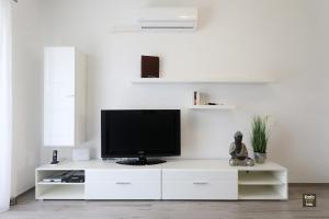 Televízia a/alebo spoločenská miestnosť v ubytovaní Carmen Apartment Deluxe