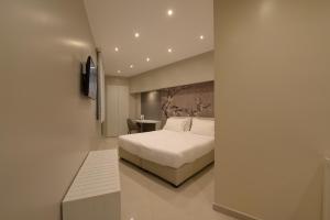 Voodi või voodid majutusasutuse Imperiali Hotel toas