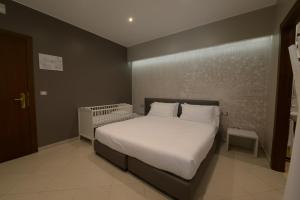 Voodi või voodid majutusasutuse Imperiali Hotel toas