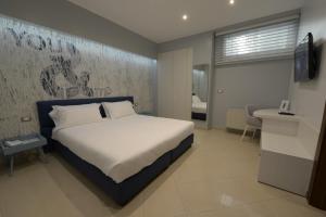 Voodi või voodid majutusasutuse Imperiali Hotel toas
